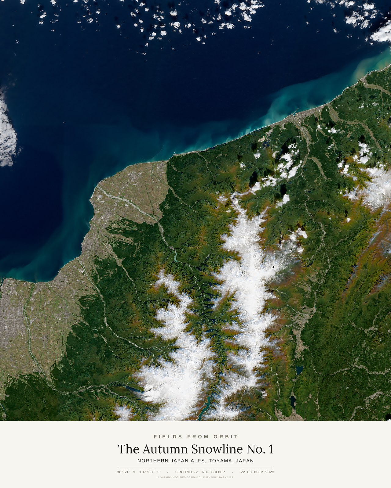 The Autumn Snowline No. 1 — satellite art poster of Northern Japan Alps, Toyama, Japan, shown with its museum label